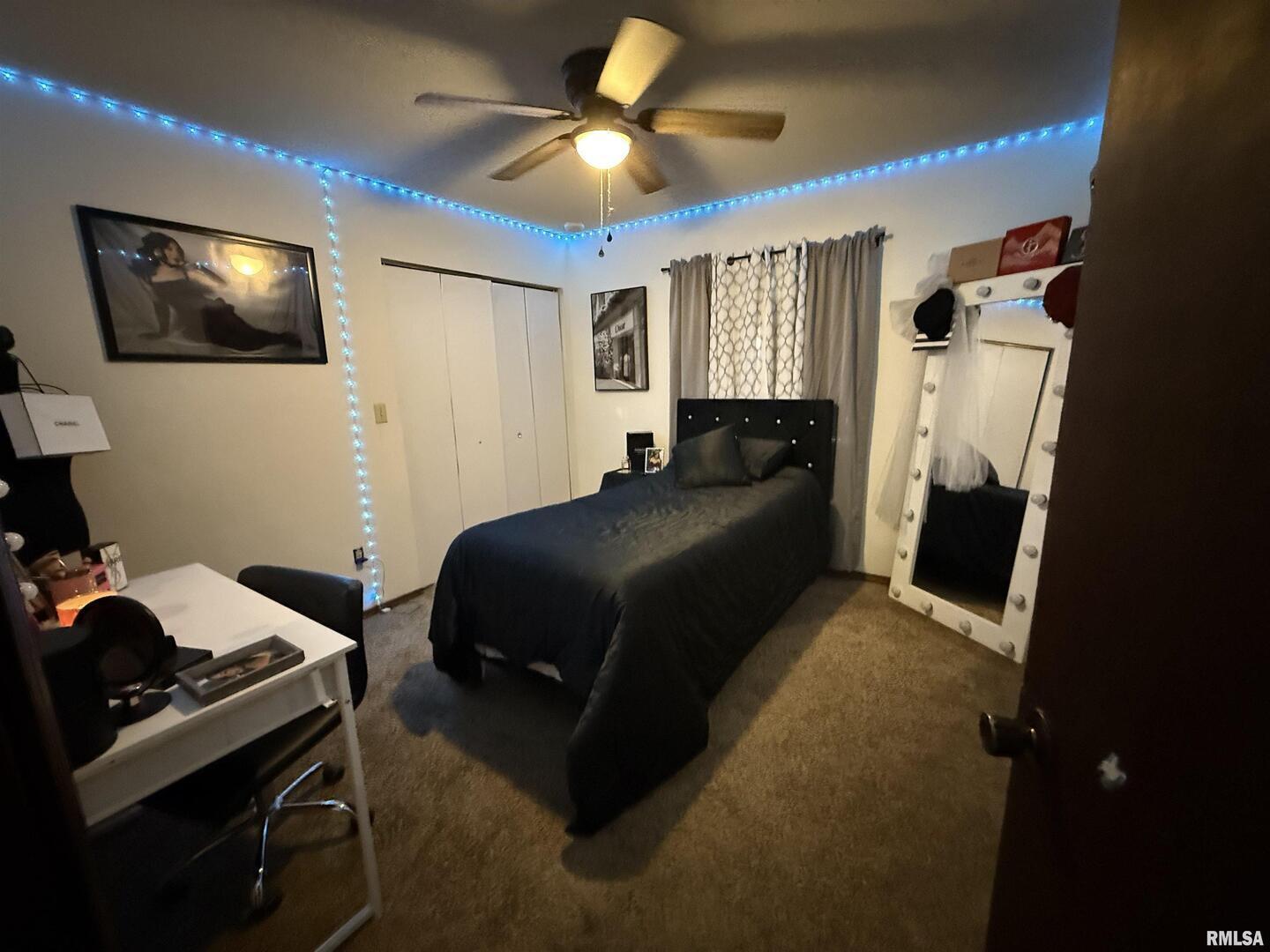 400 East Hester Street Carbondale, IL 62901 - Photo 12 of 24 a bedroom with a bed and a flat screen tv