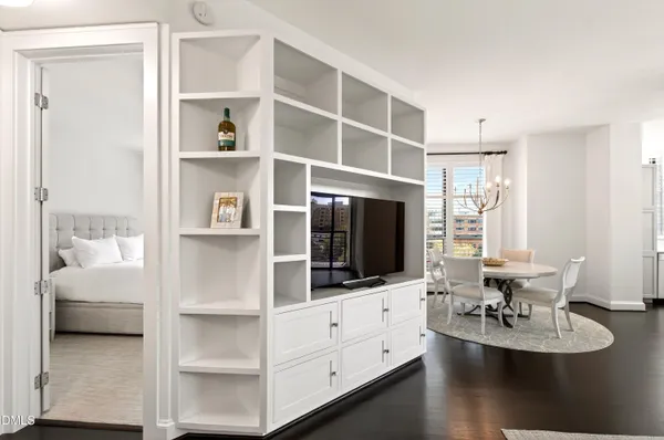 a living room with furniture and flat screen tv
