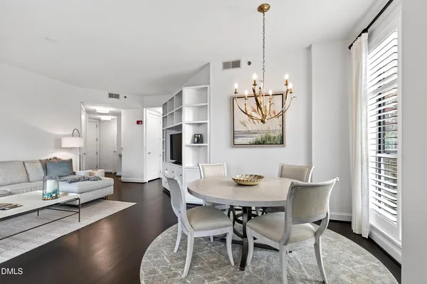 a view of a dining room with furniture window and wooden floor