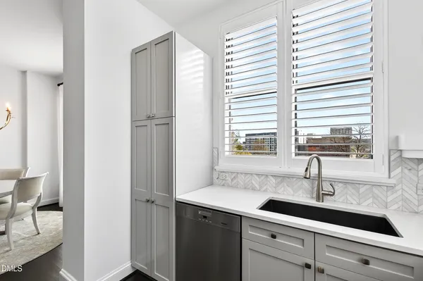 a view of living room with furniture and a large window