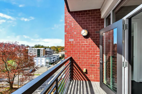 a bedroom with a bed and a night stand