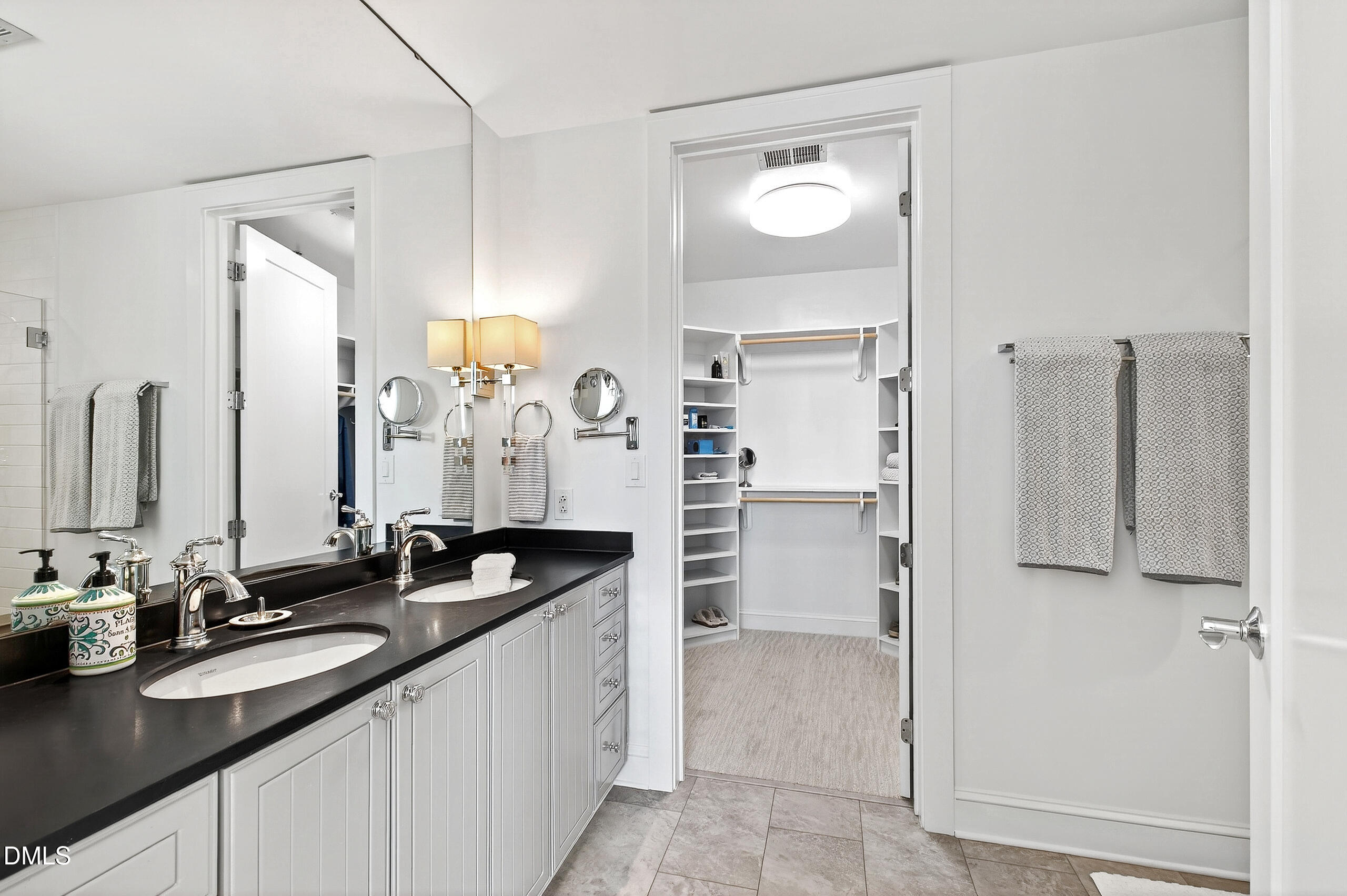 618 North Boylan Avenue, Unit 506 Raleigh, NC 27603 - Photo 25 of 71 a bathroom with a granite countertop sink and a mirror