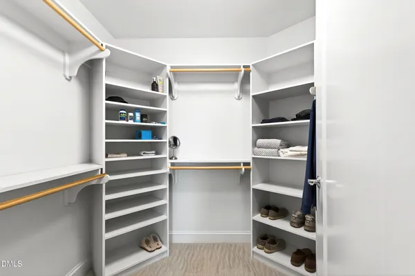 a bedroom with a bed and a closet