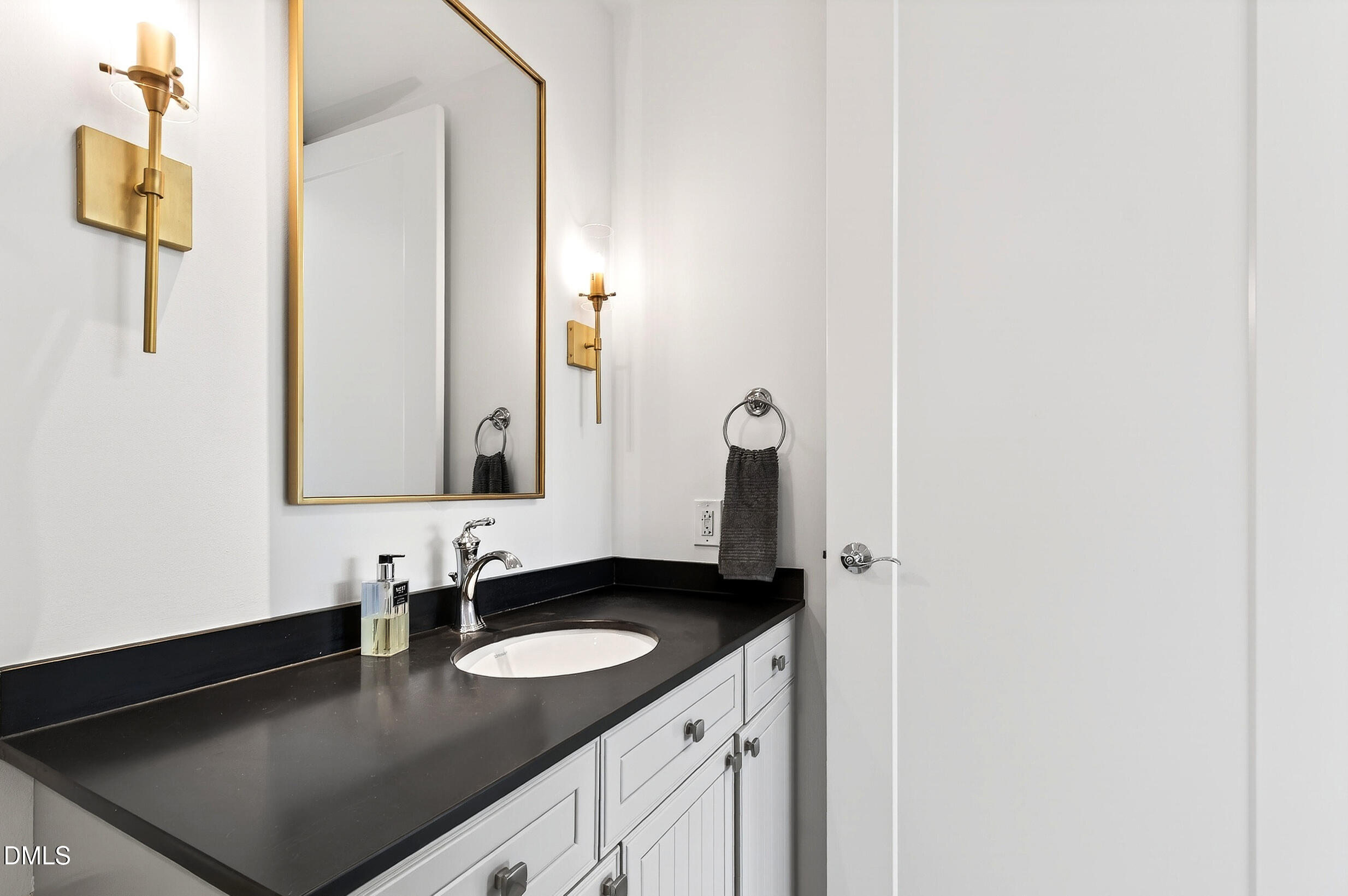 618 North Boylan Avenue, Unit 506 Raleigh, NC 27603 - Photo 33 of 71 a bathroom with a sink and a mirror