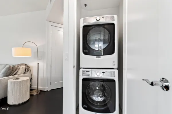 a view of a patio with chairs and potted plants