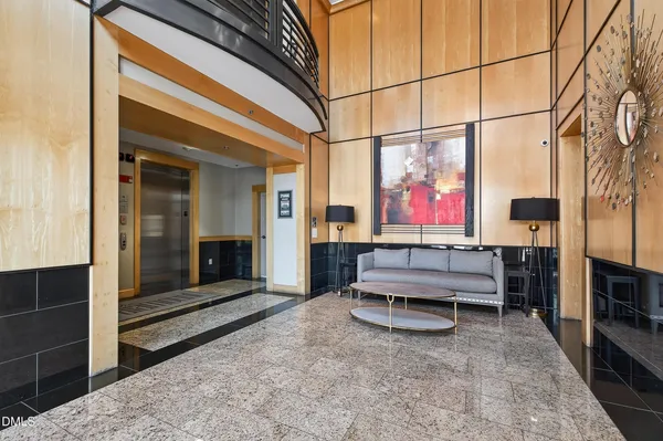 a view of a swimming pool with chairs in patio