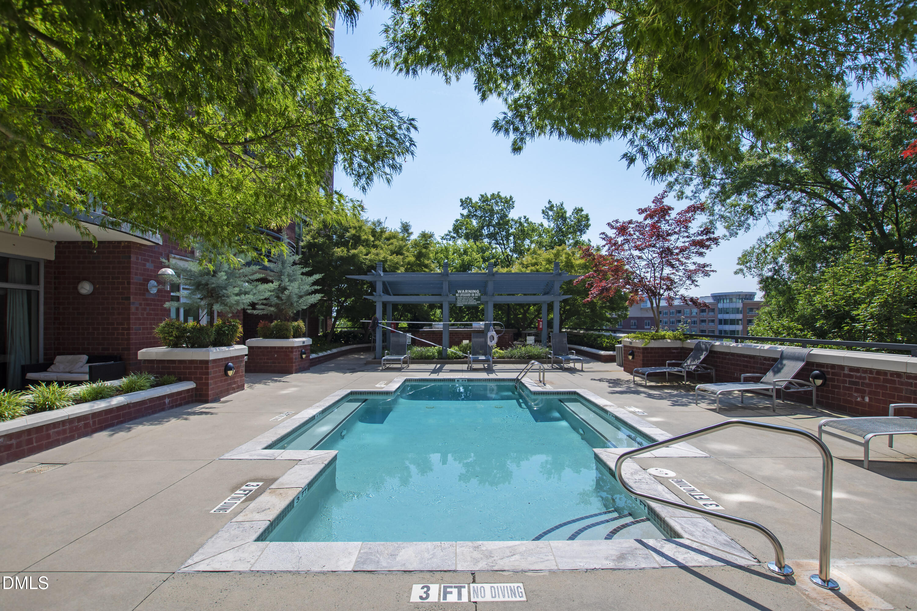 618 North Boylan Avenue, Unit 506 Raleigh, NC 27603 - Photo 42 of 71 a view of a swimming pool with chairs in patio