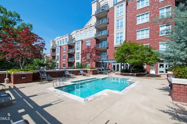 a living room with fireplace furniture and a flat screen tv