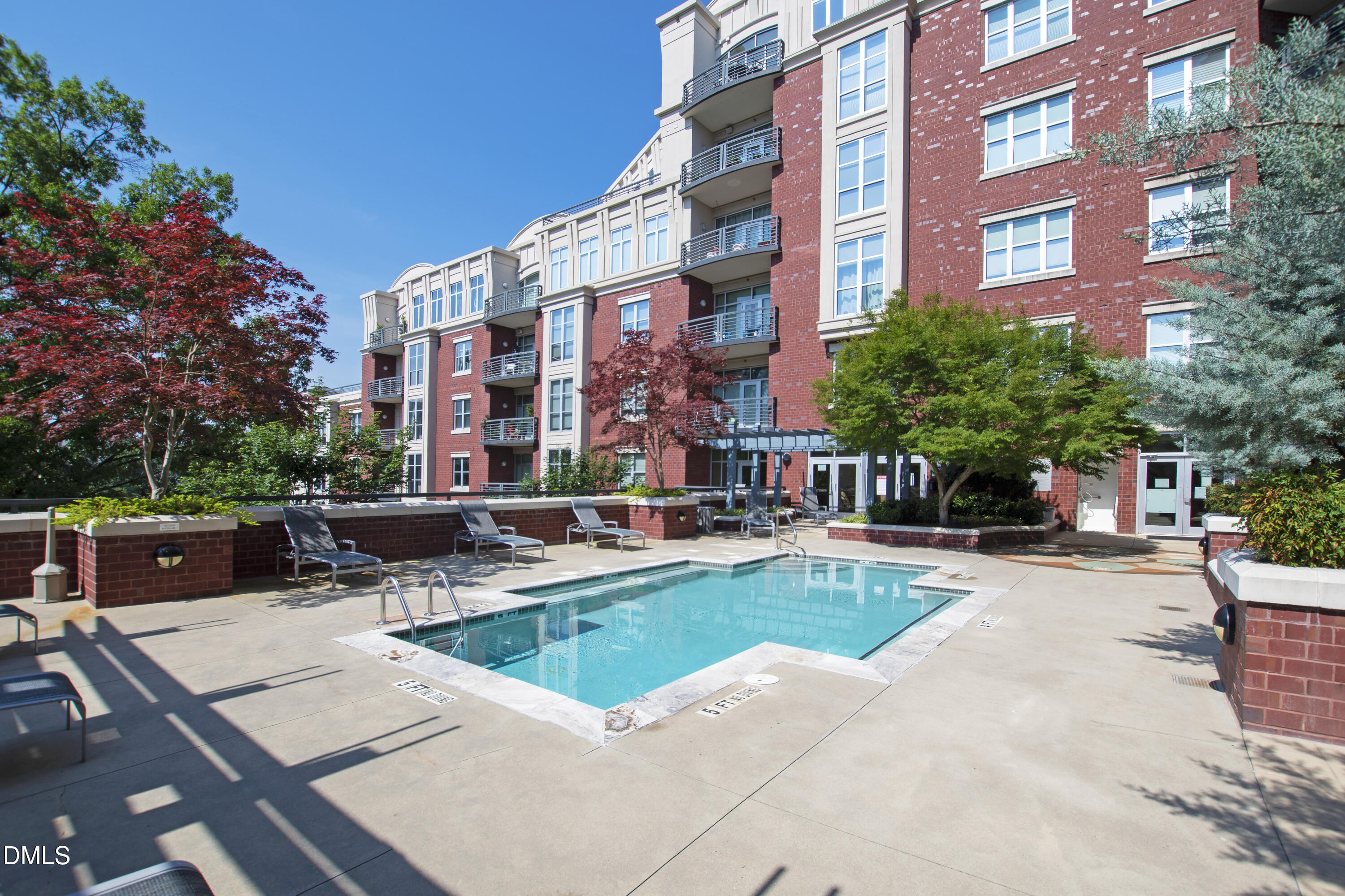 618 North Boylan Avenue, Unit 506 Raleigh, NC 27603 - Photo 44 of 71 a view of a building with a swimming pool and sitting area