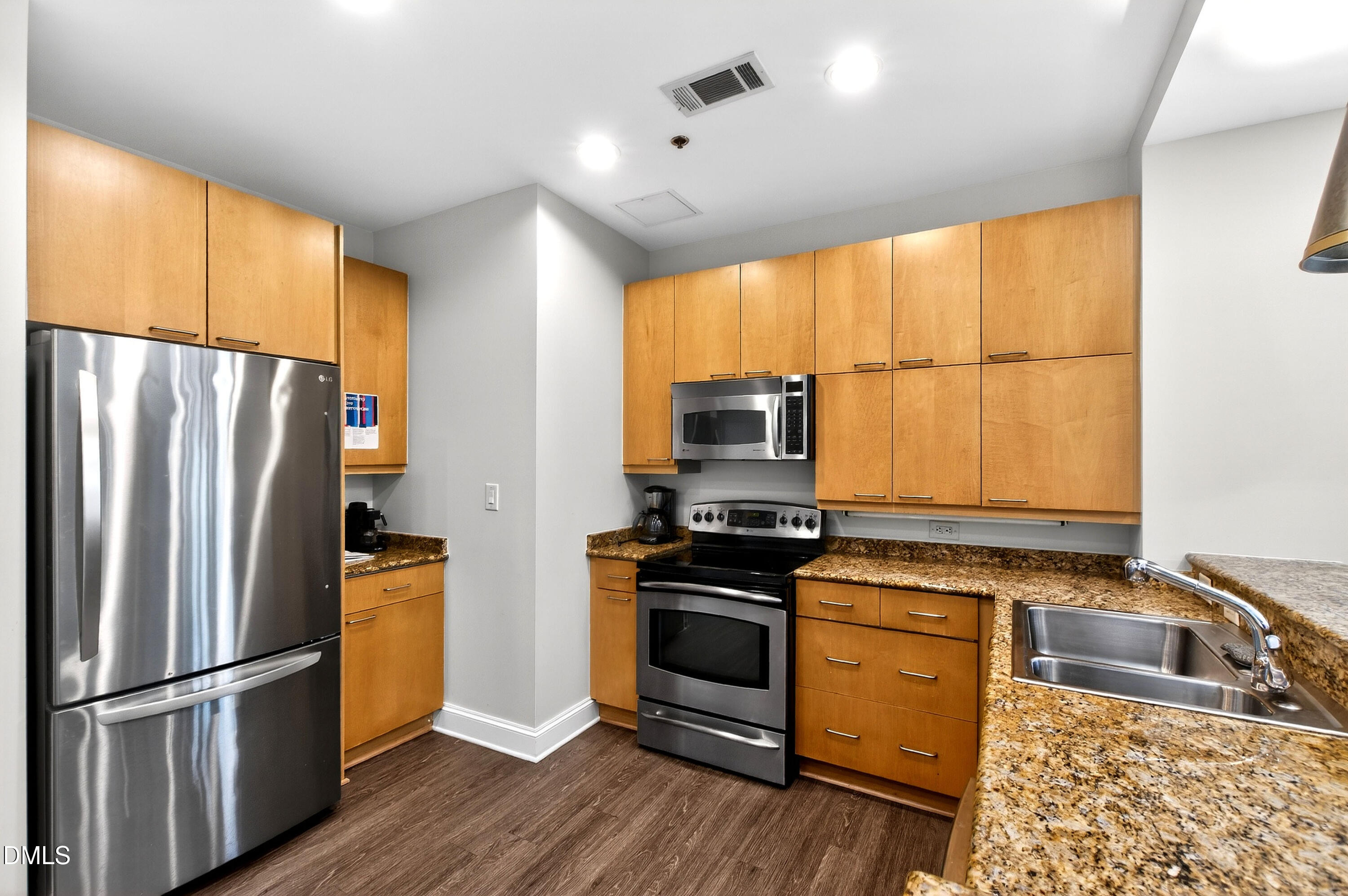 618 North Boylan Avenue, Unit 506 Raleigh, NC 27603 - Photo 48 of 71 a kitchen with stainless steel appliances a stove sink and refrigerator