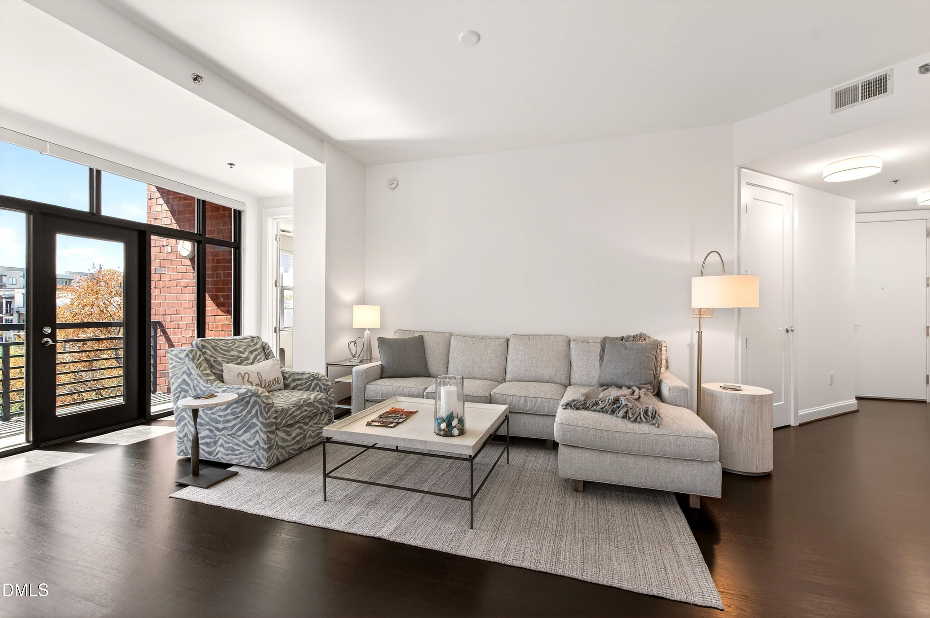 618 North Boylan Avenue, Unit 506 Raleigh, NC 27603 - Photo 5 of 71 a living room with furniture and a large window