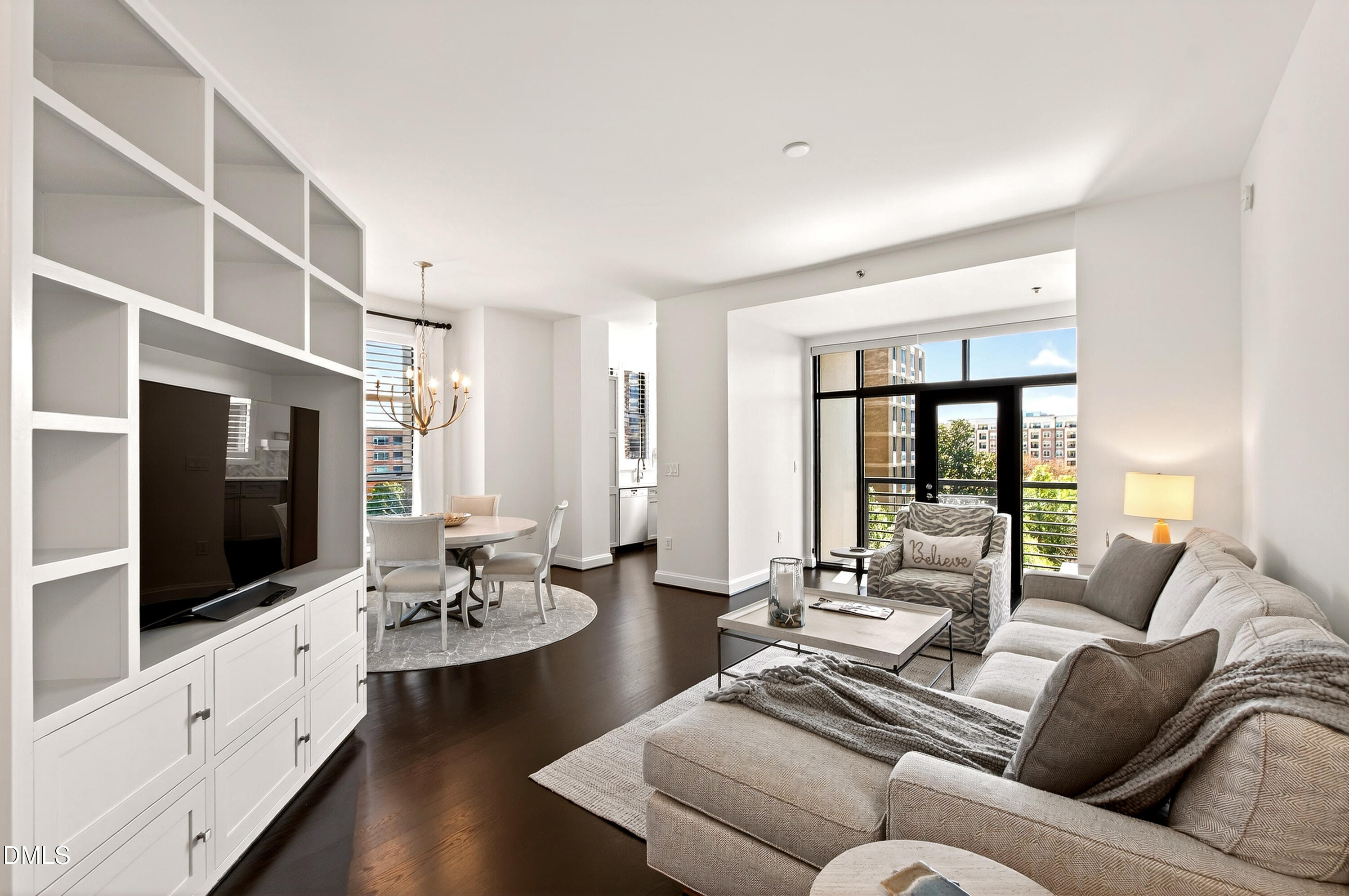 618 North Boylan Avenue, Unit 506 Raleigh, NC 27603 - Photo 8 of 71 a living room with furniture flat screen tv and large window