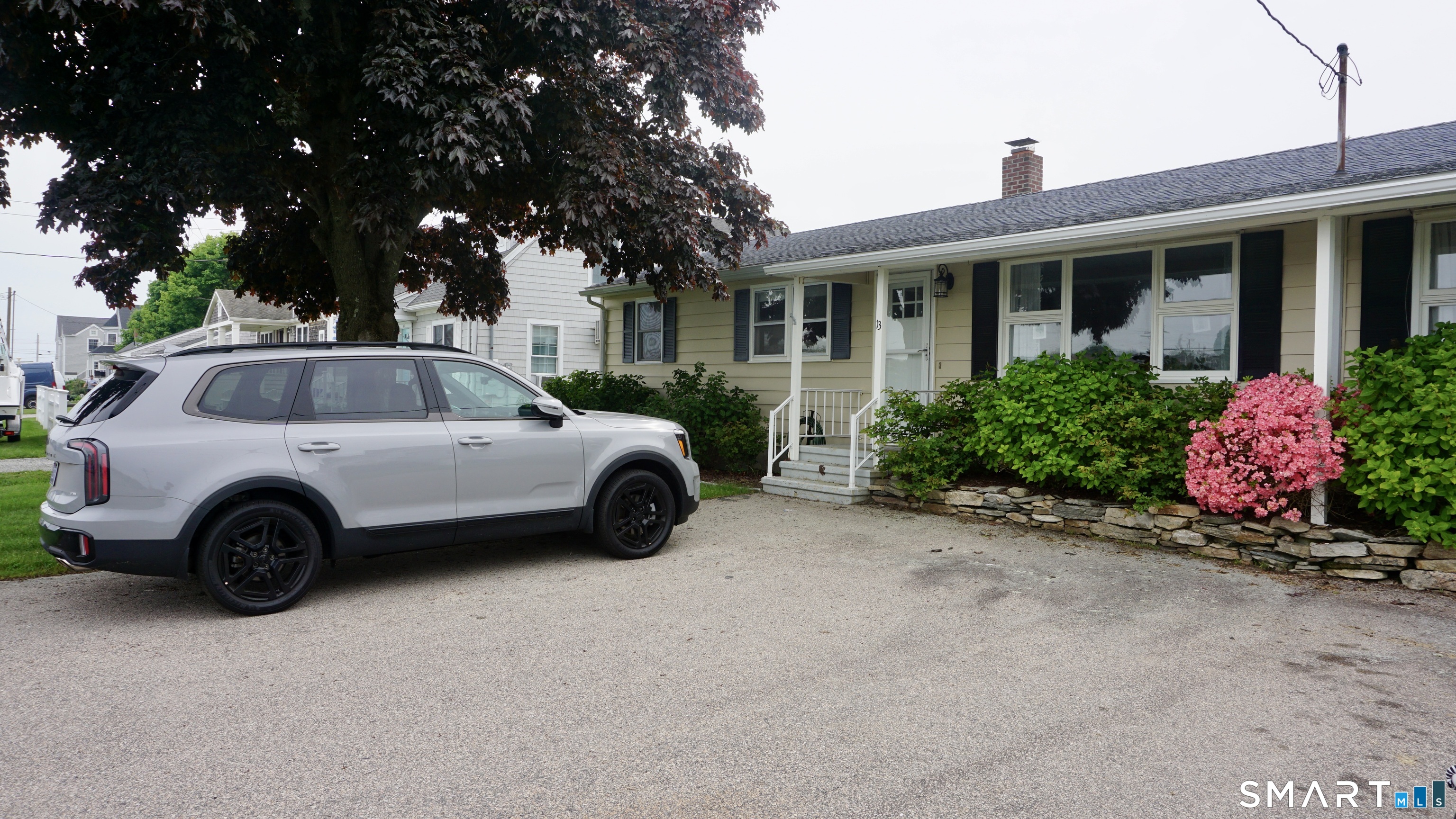 13 Pacific Street Groton, CT 06340 - Photo 3 of 31 a view of a car parked in front of a house