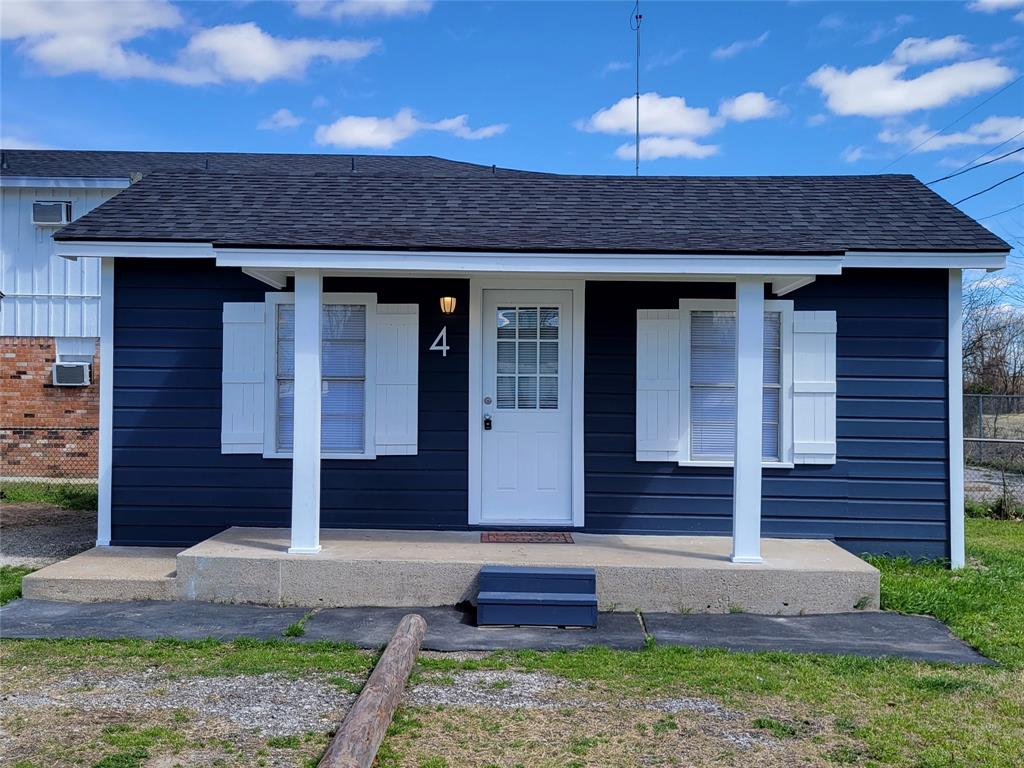 1901 Highway 276, Unit 4 West Tawakoni, TX 75474 - Photo 2 of 11 a front view of a house with garden