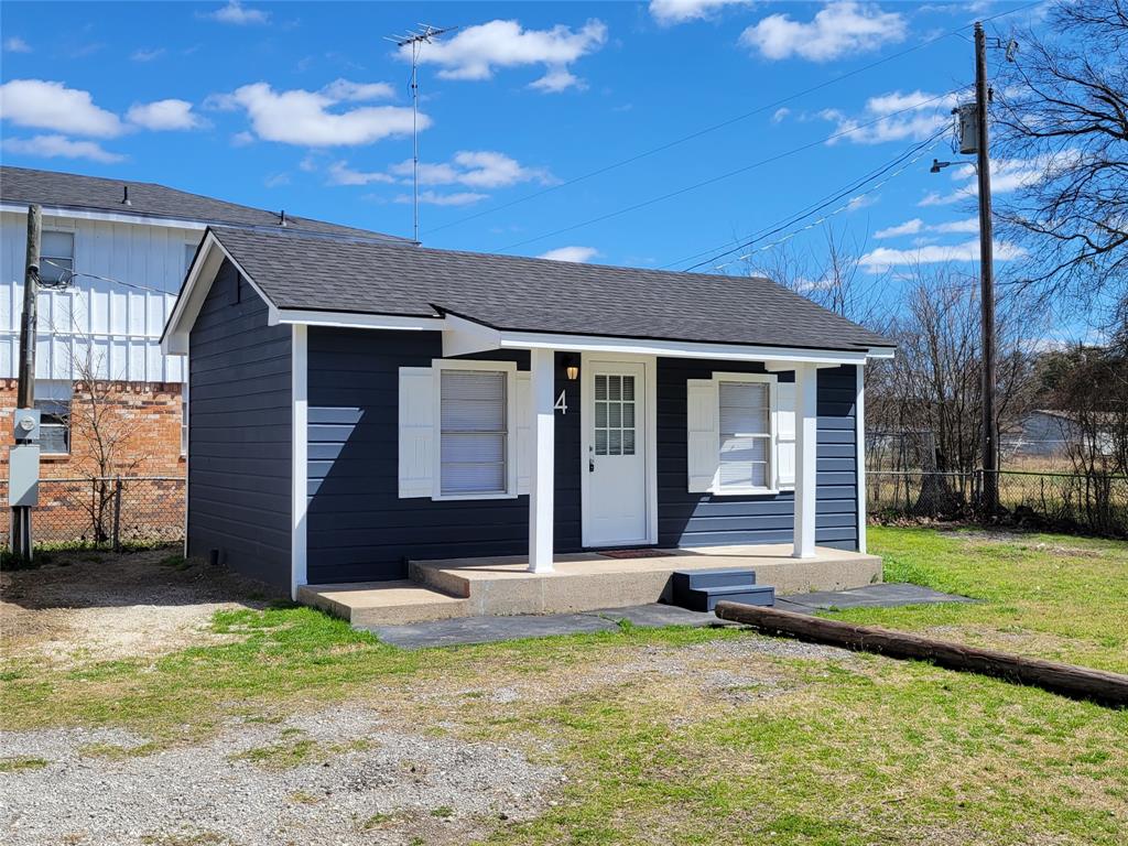 1901 Highway 276, Unit 4 West Tawakoni, TX 75474 - Photo 3 of 11 a front view of a house with a yard