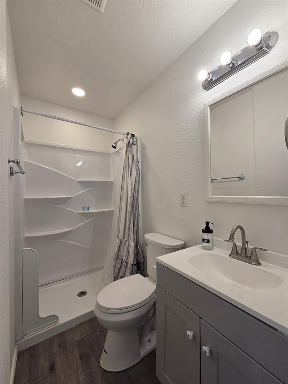 1901 Highway 276, Unit 4 West Tawakoni, TX 75474 - Photo 9 of 11 a bathroom with a sink a toilet and shower