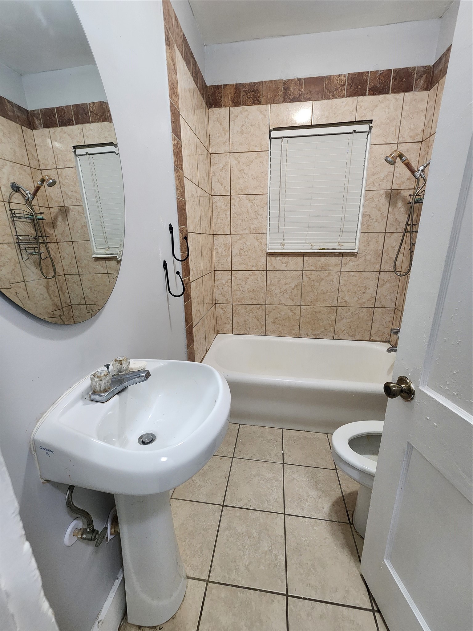 2504 Isabella Street Houston, TX 77004 - Photo 12 of 13 a bathroom with a sink a toilet and bathtub