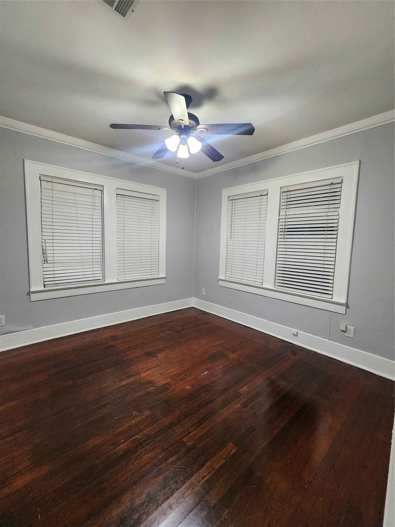 2504 Isabella Street Houston, TX 77004 - Photo 13 of 13 a view of an empty room with wooden floor and a window
