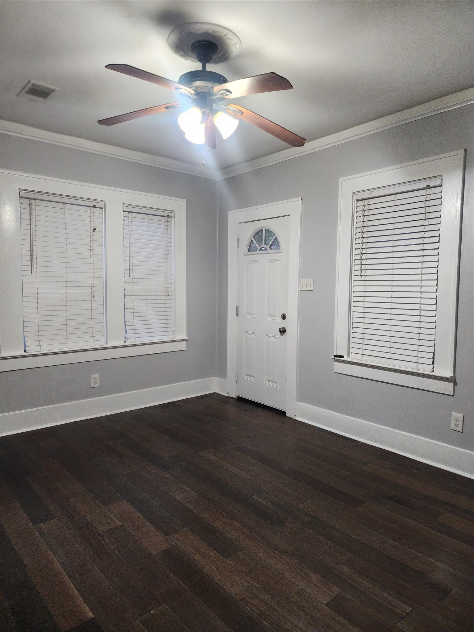 2504 Isabella Street Houston, TX 77004 - Photo 2 of 13 a view of an empty room with wooden floor and a window