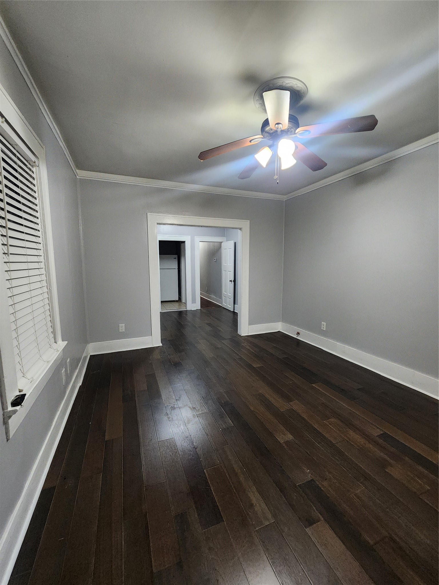 2504 Isabella Street Houston, TX 77004 - Photo 3 of 13 wooden floor in an empty room with a window