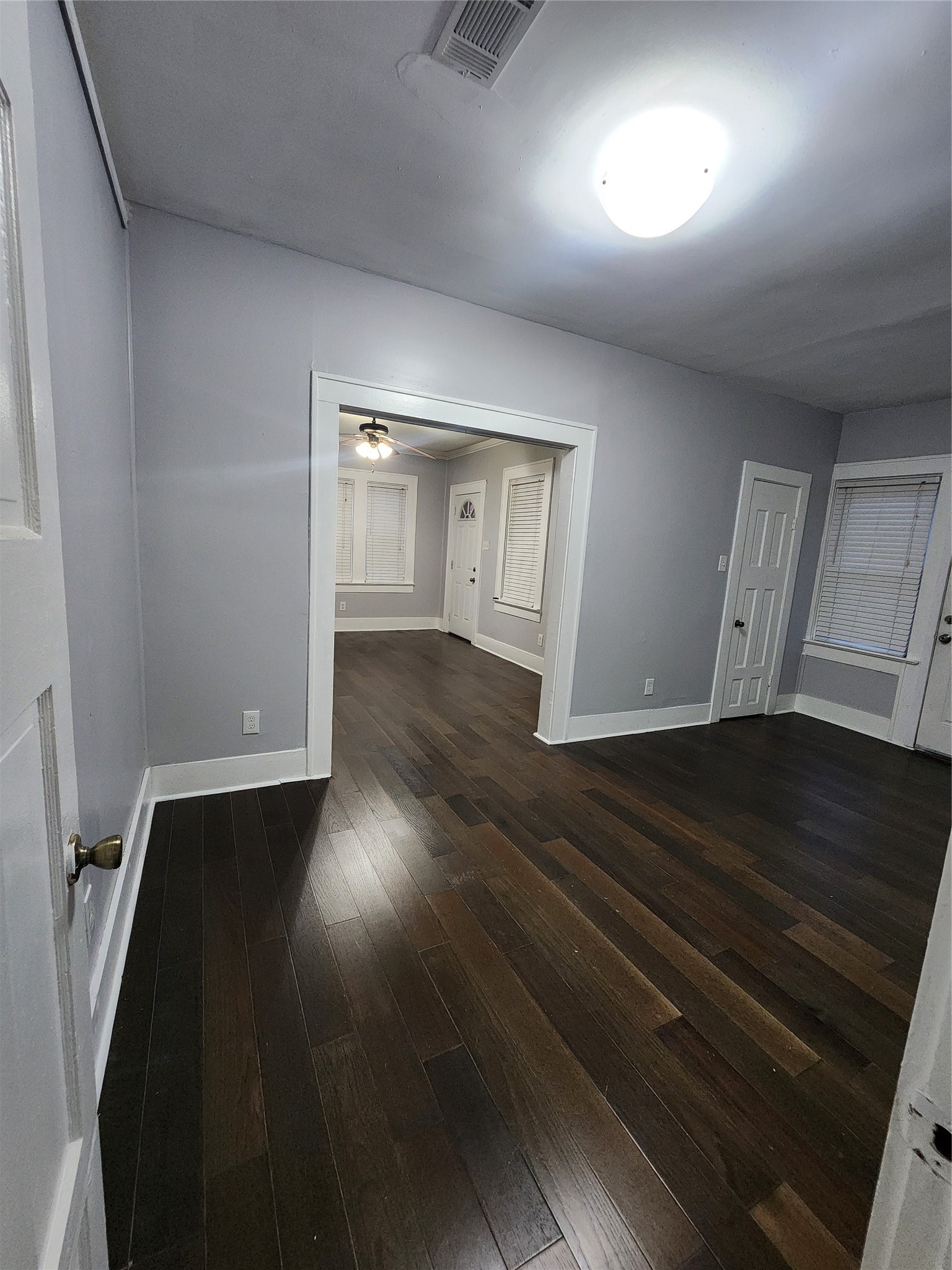 2504 Isabella Street Houston, TX 77004 - Photo 4 of 13 an empty room with wooden floor and cabinet