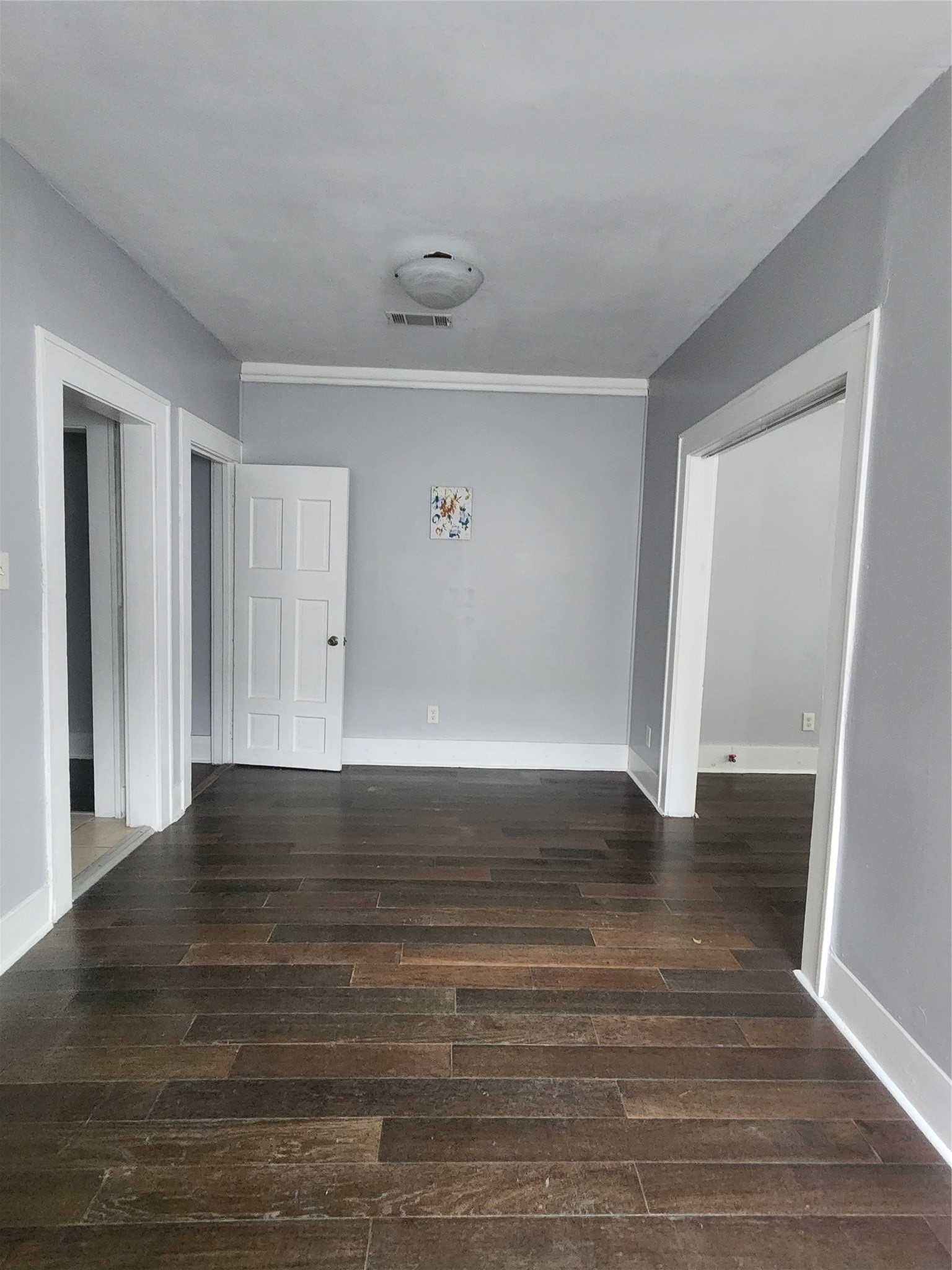 2504 Isabella Street Houston, TX 77004 - Photo 6 of 13 a view of an empty room with wooden floor and closet