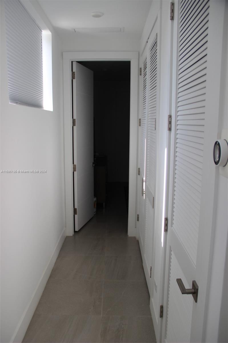 2944 Southwest 27th Terrace, Unit 2944 Miami, FL 33133 - Photo 18 of 44 a view of a hallway with closet