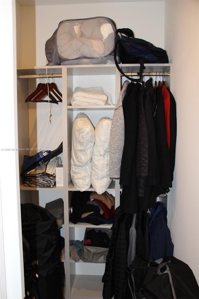 2944 Southwest 27th Terrace, Unit 2944 Miami, FL 33133 - Photo 23 of 44 a view of walk in closet with clothes and shoes