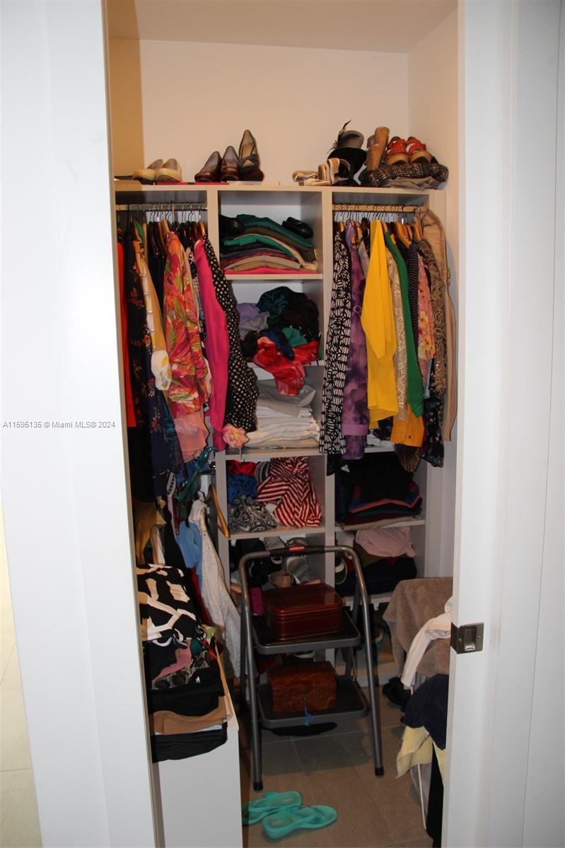 2944 Southwest 27th Terrace, Unit 2944 Miami, FL 33133 - Photo 24 of 44 a view of walk in closet with clothes and shoes