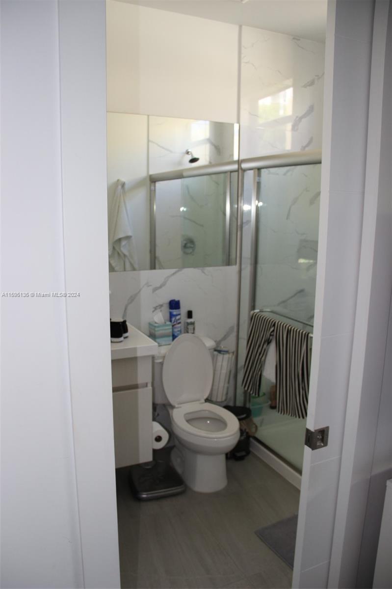 2944 Southwest 27th Terrace, Unit 2944 Miami, FL 33133 - Photo 26 of 44 a bathroom with a toilet and a shower