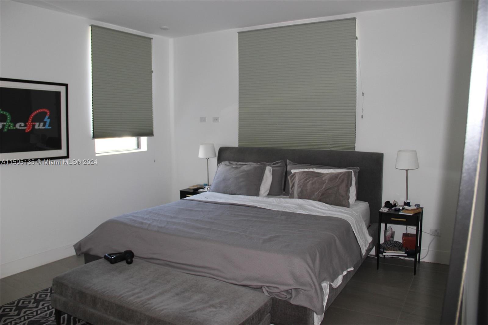 2944 Southwest 27th Terrace, Unit 2944 Miami, FL 33133 - Photo 28 of 44 a bedroom with a bed and a tv on table