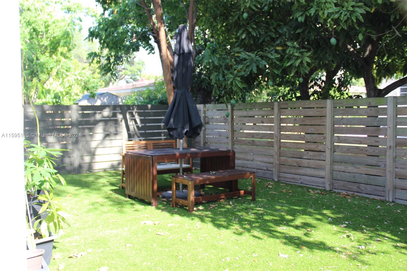 2944 Southwest 27th Terrace, Unit 2944 Miami, FL 33133 - Photo 36 of 44 a view of a backyard with sitting area