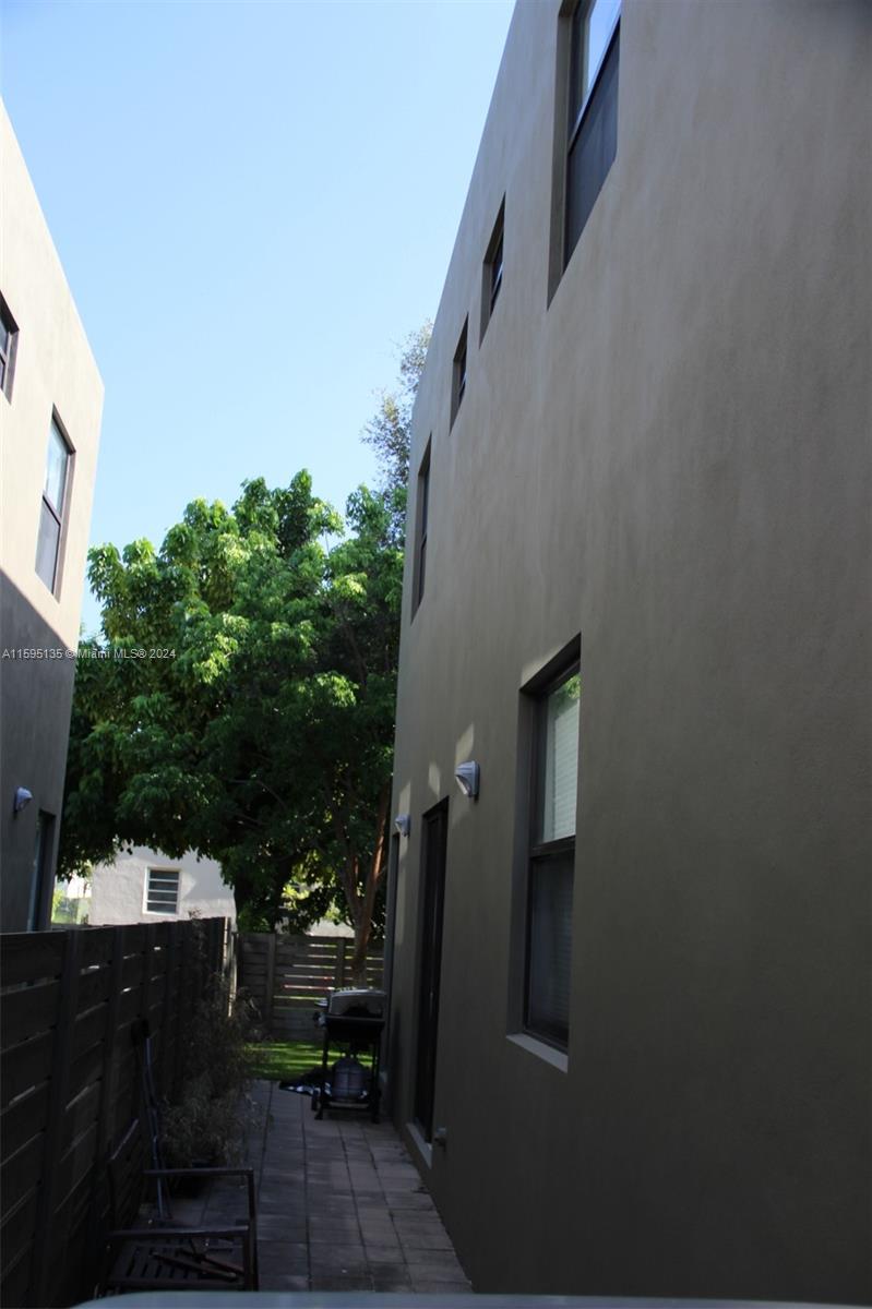 2944 Southwest 27th Terrace, Unit 2944 Miami, FL 33133 - Photo 39 of 44 a view of backyard path with seating space