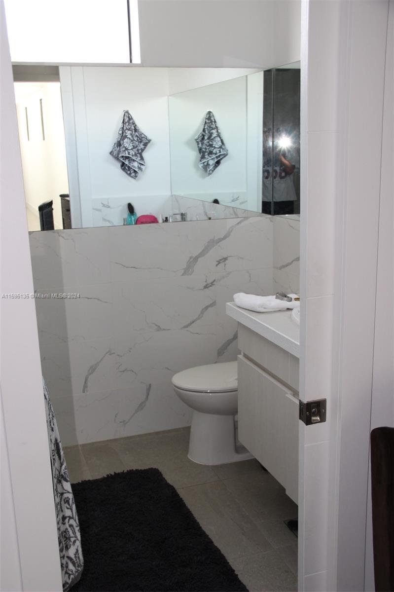 2944 Southwest 27th Terrace, Unit 2944 Miami, FL 33133 - Photo 41 of 44 a bathroom with a toilet and a sink