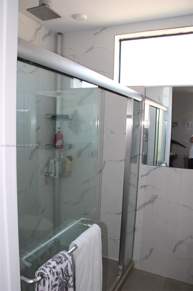 2944 Southwest 27th Terrace, Unit 2944 Miami, FL 33133 - Photo 42 of 44 a bathroom with a shower
