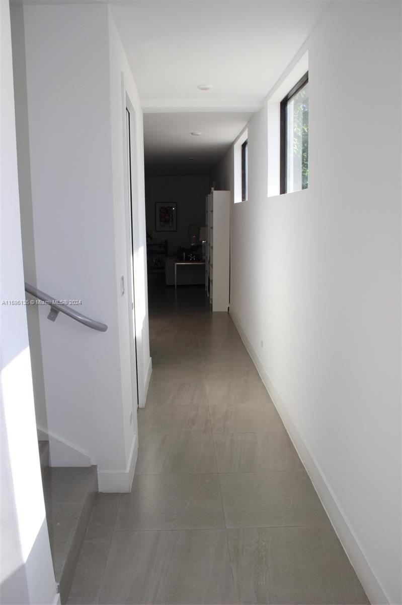 2944 Southwest 27th Terrace, Unit 2944 Miami, FL 33133 - Photo 6 of 44 a view of a hallway