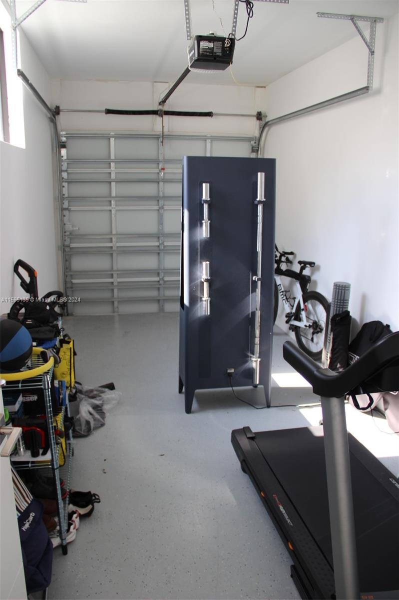 2944 Southwest 27th Terrace, Unit 2944 Miami, FL 33133 - Photo 7 of 44 a view of a room with gym equipment