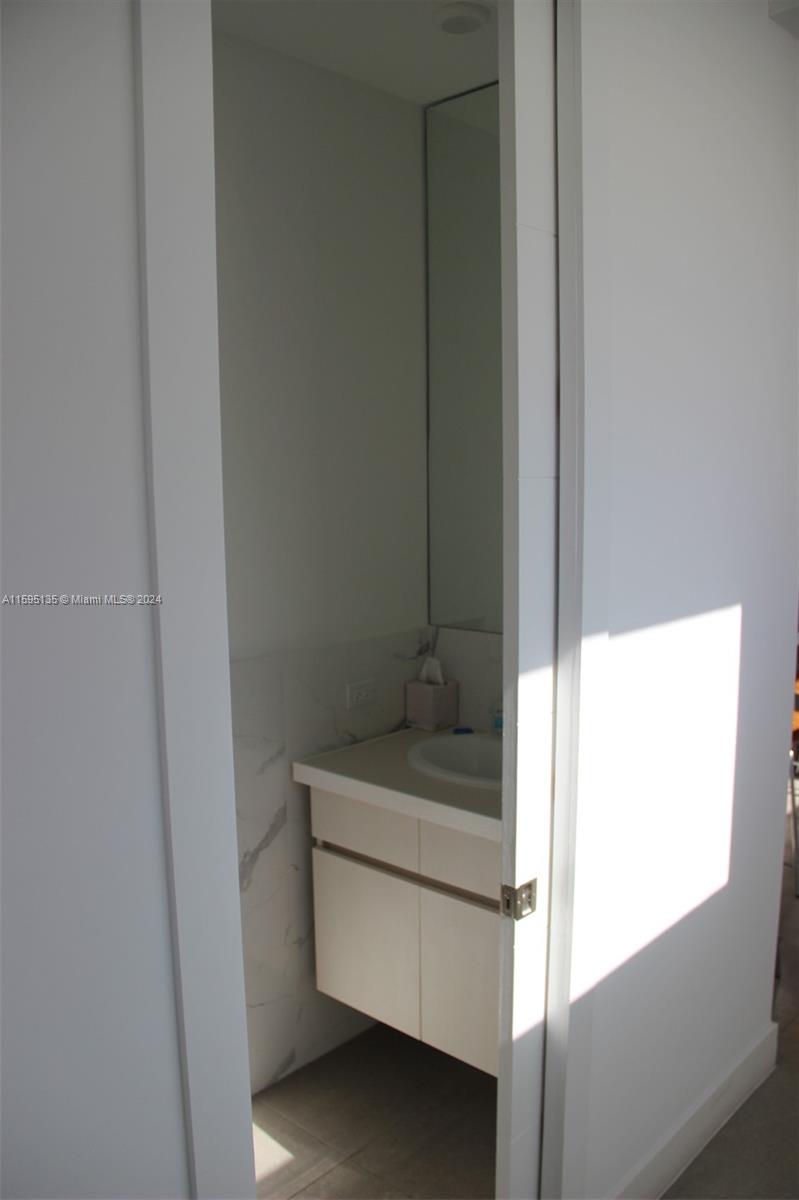 2944 Southwest 27th Terrace, Unit 2944 Miami, FL 33133 - Photo 9 of 44 a bathroom with a sink
