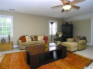 3527 Nestling Lane Fort Mill, SC 29708 - Photo 14 of 16 a living room with furniture and a chandelier
