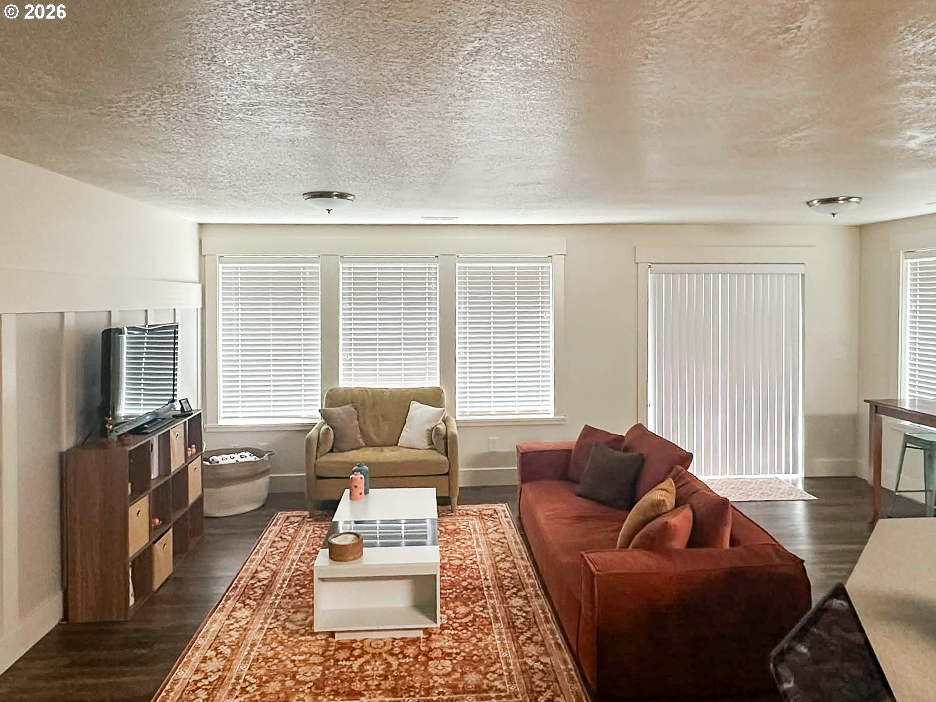 1601 Spruce Drive Seaside, OR 97138 - Photo 3 of 7 a living room with furniture and a flat screen tv