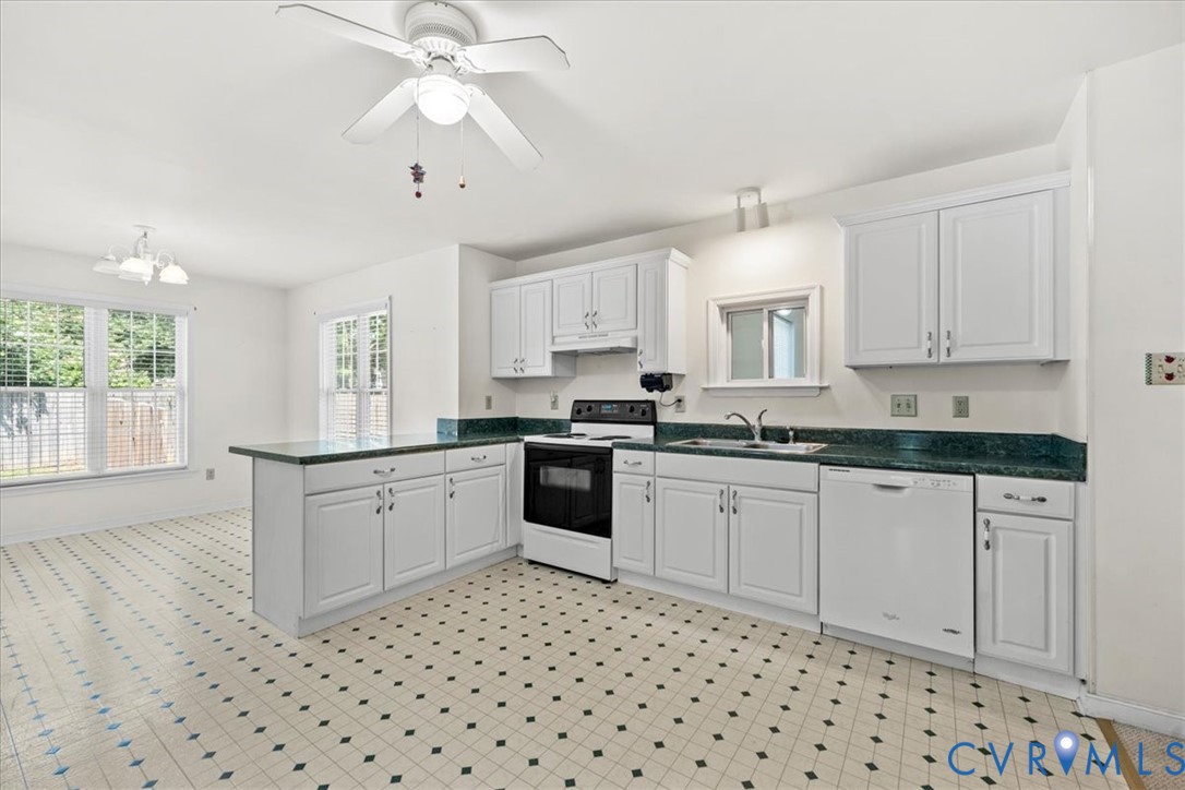 2924 Warfield Ridge Terrace Chester, VA 23831 - Photo 2 of 38 Kitchen with white cabinetry, dark green counterto
