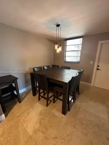 a kitchen with stainless steel appliances granite countertop a refrigerator a sink and a stove