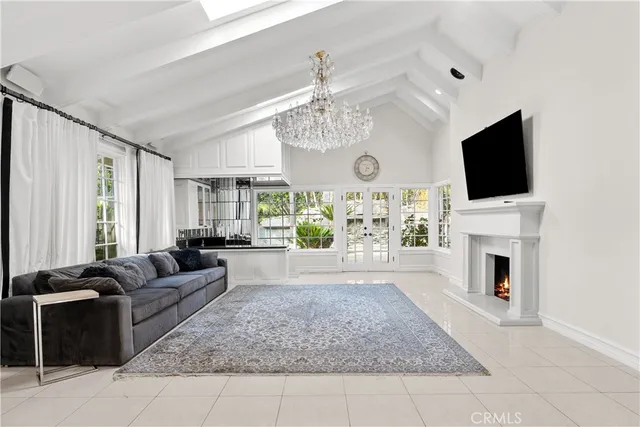 a living room with fireplace furniture and a flat screen tv