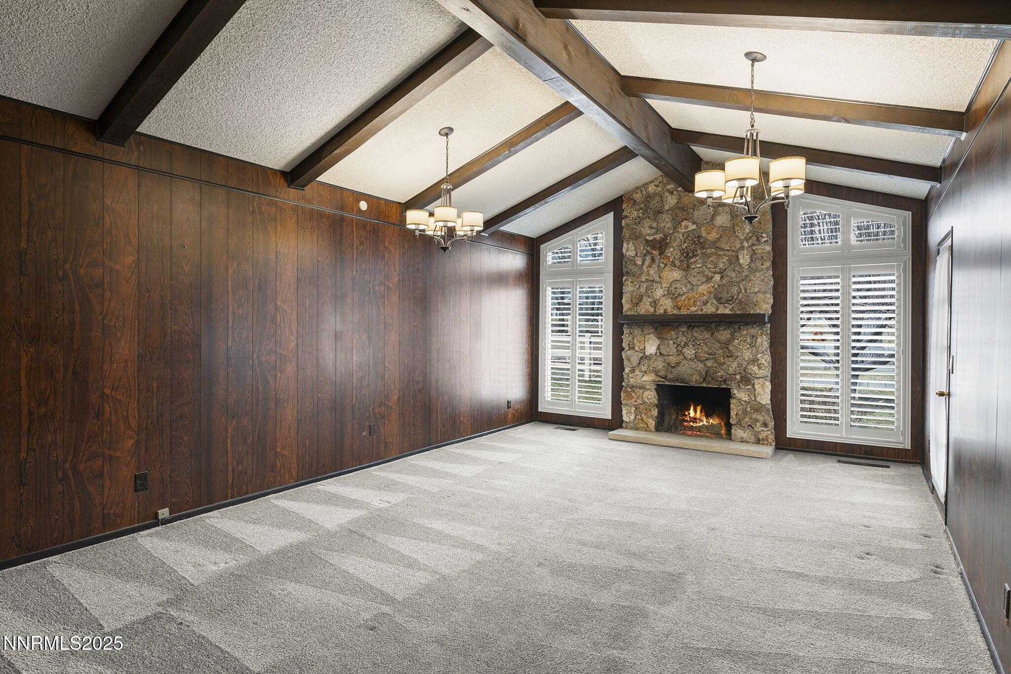 8355 Lakeside Drive Reno, NV 89511 - Photo 13 of 36 a view of an empty room with a fireplace and a window