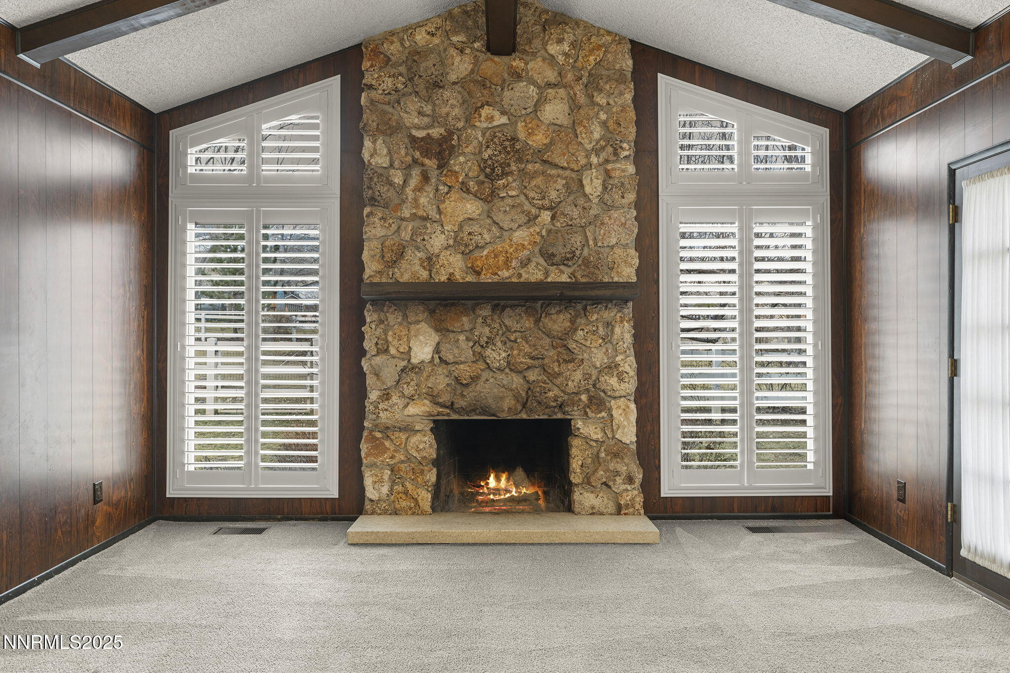 8355 Lakeside Drive Reno, NV 89511 - Photo 15 of 36 a view of an empty room with a fireplace and windows