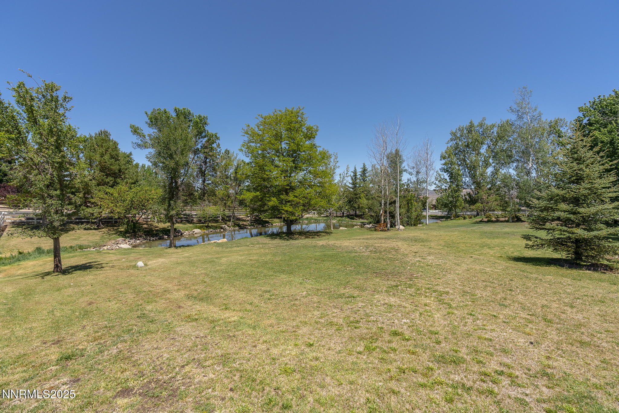 8355 Lakeside Drive Reno, NV 89511 - Photo 35 of 36 a view of a field with trees in the background