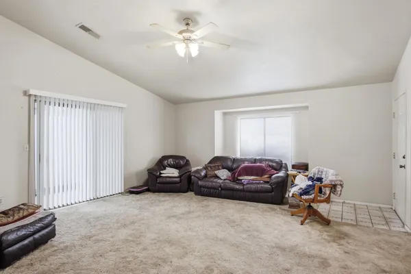 a bedroom with a bed and a couch