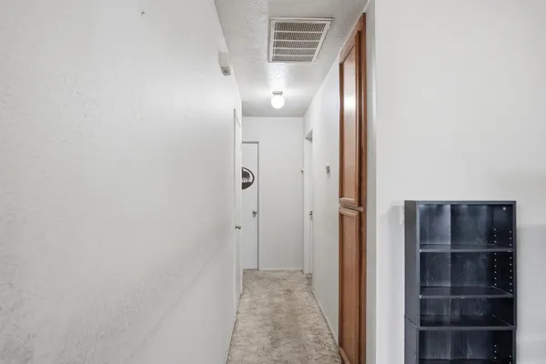 a kitchen with stainless steel appliances a sink a stove a refrigerator and cabinets