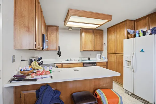 a view of a kitchen with workspace and a window