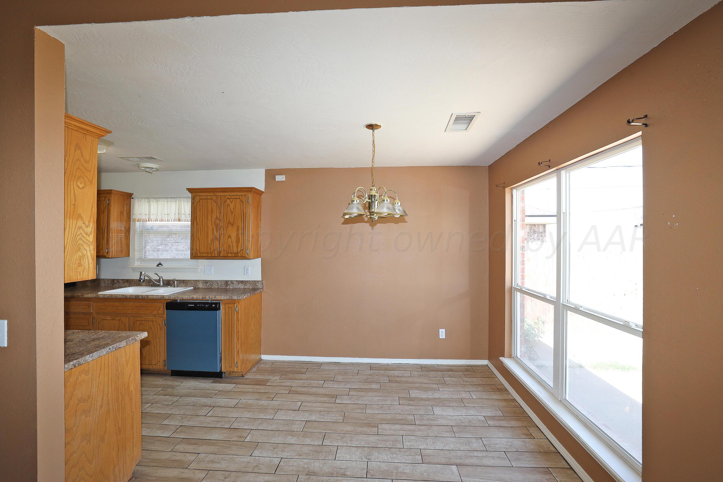 1025 Ketler Street Amarillo, TX 79104 - Photo 11 of 29 a view of a kitchen with a sink and a window